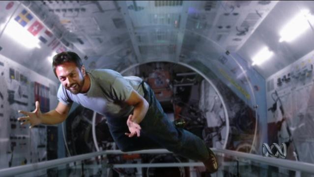 Man floats in zero gravity environment, possibly International Space Station