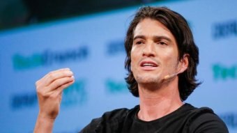 Former WeWork boss Adam Neumann speaks to a  crowd.