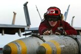 Weapons technology deal: A crewman with guided bombs on the USS Kitty Hawk (File photo)