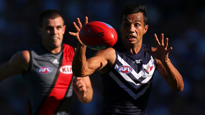 In front ... Danyle Pearce looks to gather the ball for the Dockers