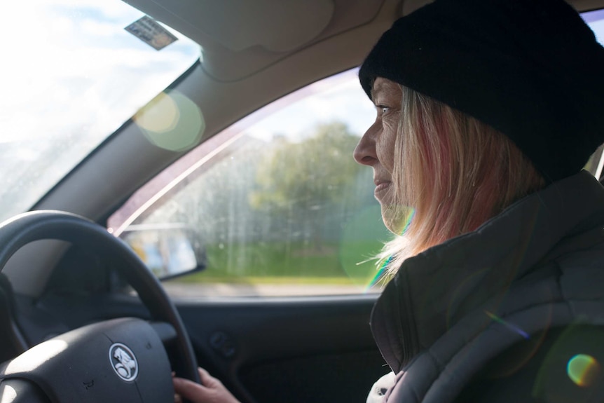 Sue Erben driving her car.