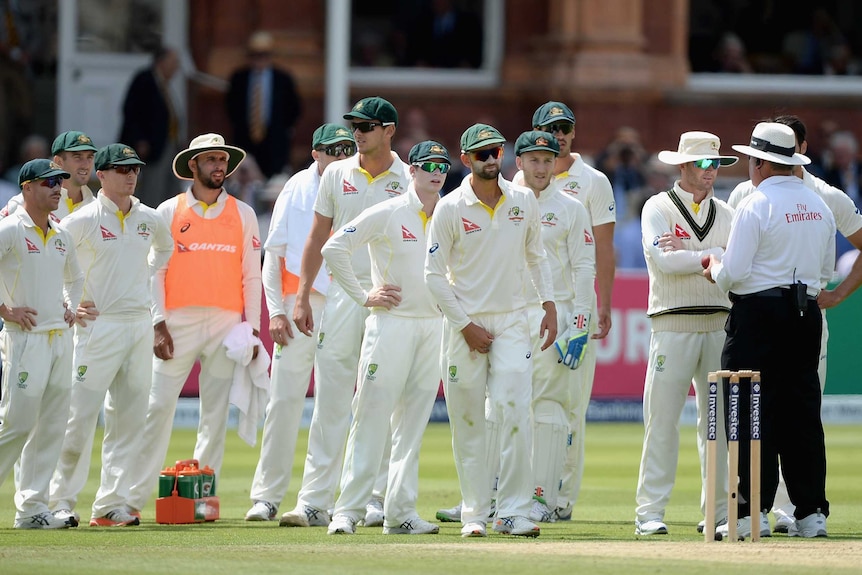 Australian players debate a decision with the umpire at Lord's