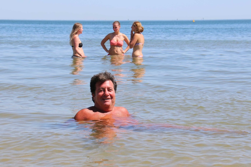 Melburnians cool of at Port Melbourne beach, during the first day of a heatwave.