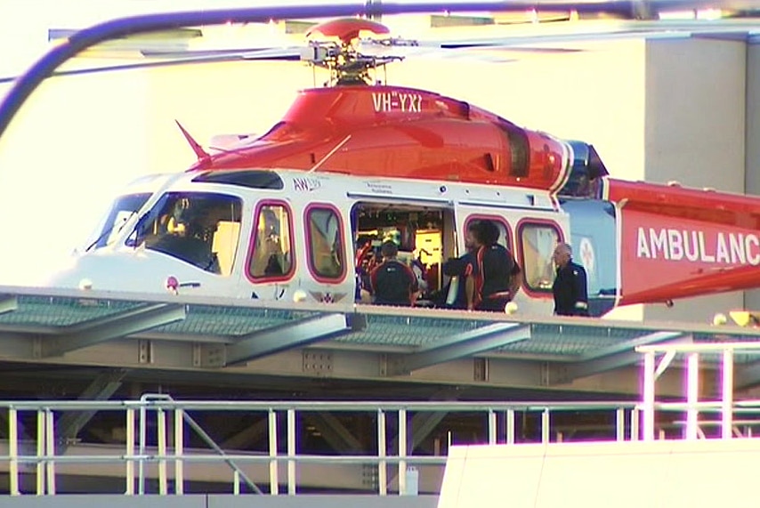 A patient is lifted from a medical rescue helicopter.