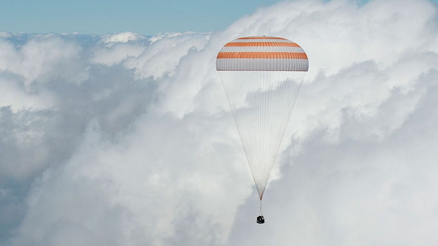 The Soyuz TMA-19M spacecraft descends to Earth