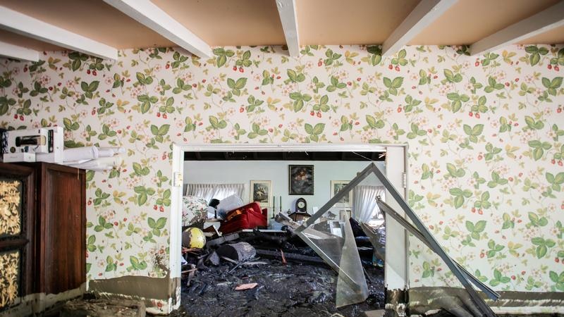 A mud-filled living room