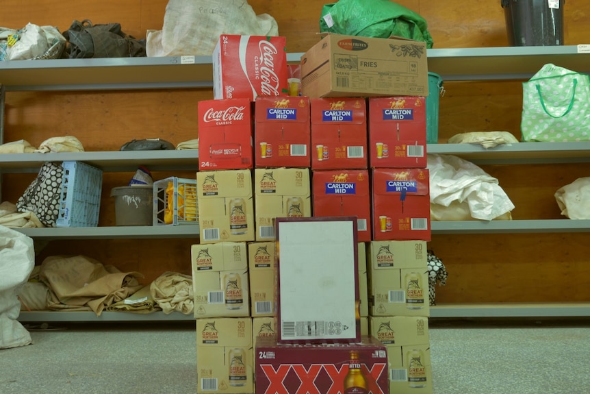 A stack of cardboard boxes at a Containers for Change warehouse