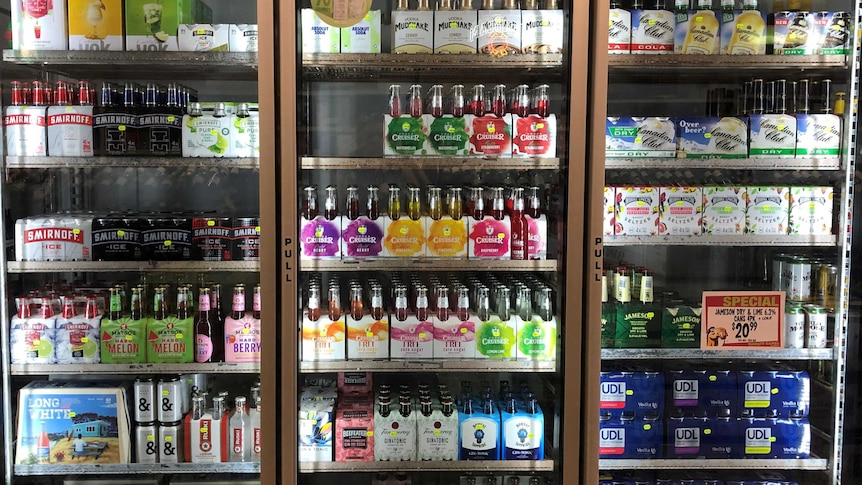 Colourfully wrapped alcohol in a fridge in a liquor store in Port Hedland