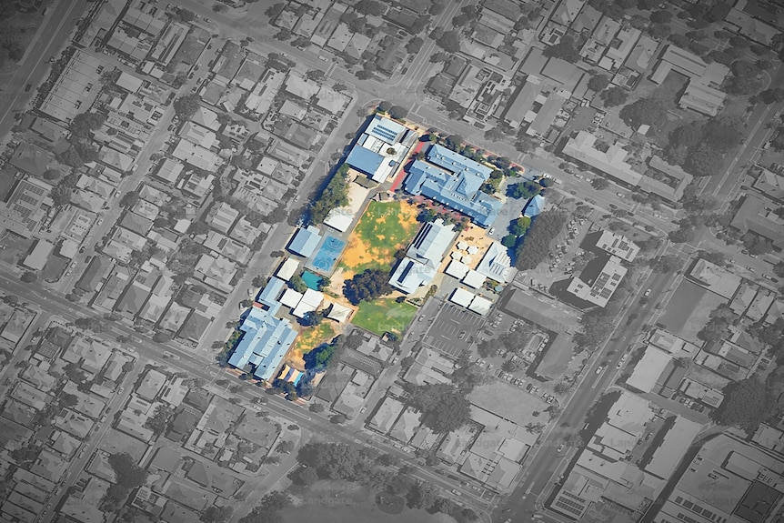 A black and white aerial photo with a coloured highlight of a primary school