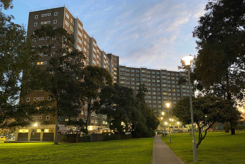 A large block of public housing flats at dusk.