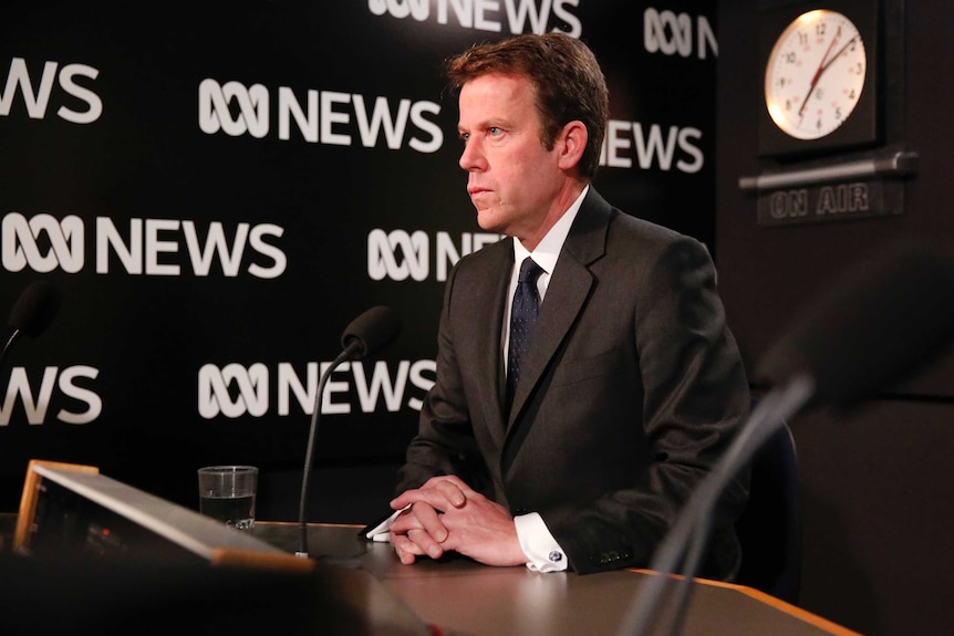 Liberal Minister Dan Tehan sitting in ABC Radio studio