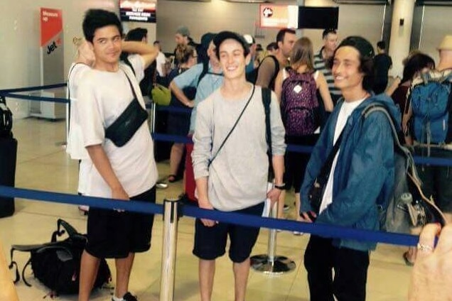 Jalada Wilson, Rin Hutcheson and Raoul Poncin queue at the airport.