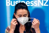 New Zealand Prime Minister Jacinda Ardern removes her mask 