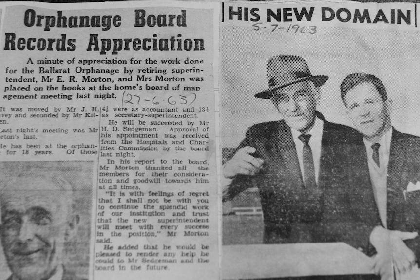 A newspaper clipping with an article and black and white photo of two men in suits. 
