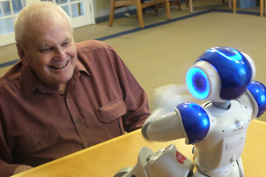 Colin Farmer with Alice the robot
