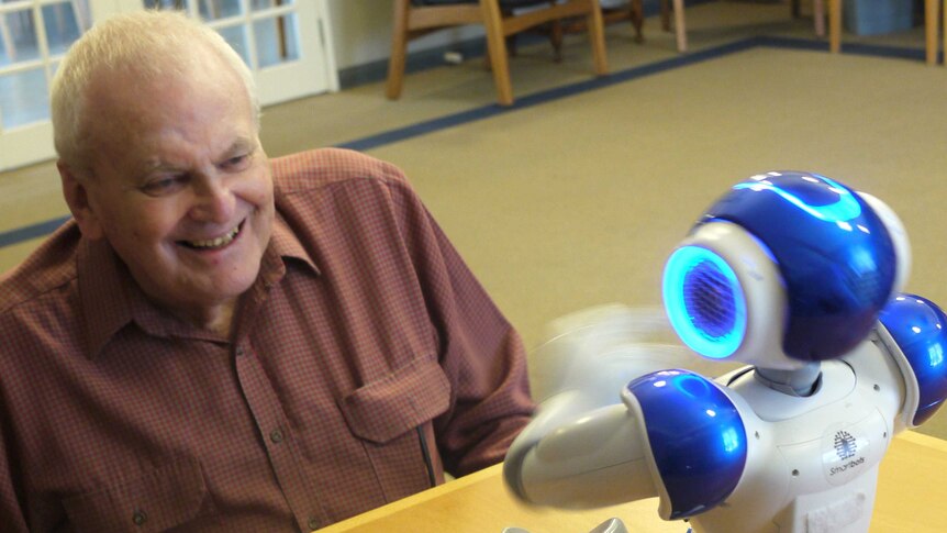 Colin Farmer with Alice the robot