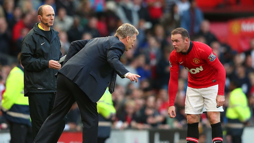 Word of advice ... United manager David Moyes (L) speaks with Wayne Rooney