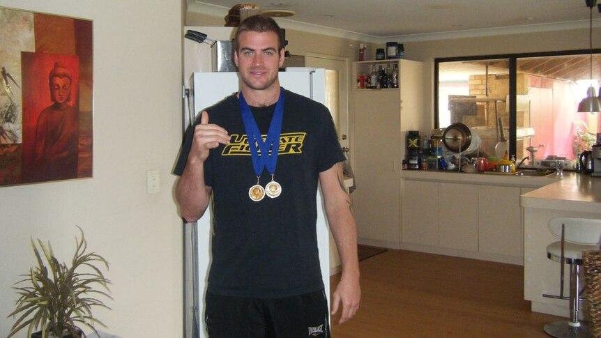 Joel with his medals