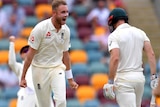 Stuart Broad yells in the direction of Shaun Marsh after the Australian batsman was dismissed on day three at the Gabba.