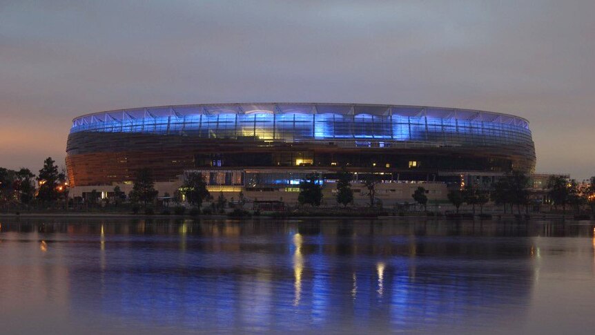 Perth Stadium with blue lights.