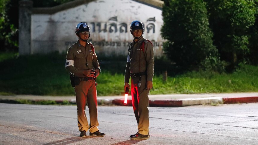 Police guard junction for ambulance from Thai cave rescue