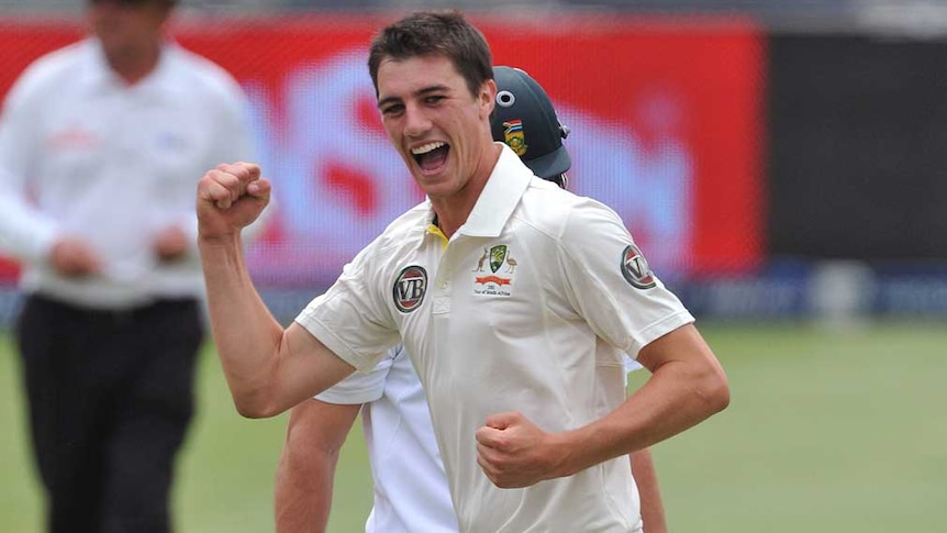 Australian paceman Pat Cummins celebrates the wicket of South Africa's AB de Villiers in 2011.