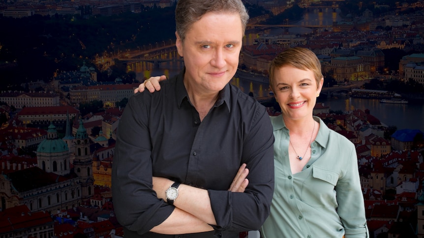 Richard Fidler and Sarah Kanowski against a background of Prague at night
