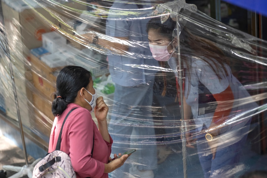 Customer wearing a protective mask in Bangkok
