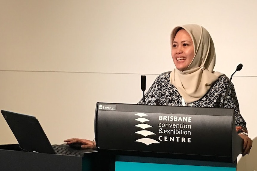 An Indonesian woman giving a speech at the Brisbane convention and exhibition centre.