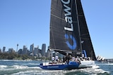 Supermaxi LawConnect sails down Sydney Harbour toward the finish line of the Big Boat Challenge.