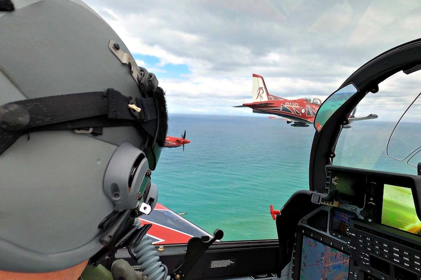 A view out the cockpit of a Roulette over water.