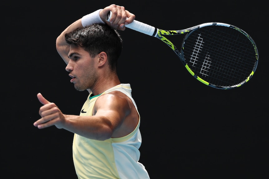 Carlos Alcaraz plays a forehand at the 2024 Australian Open.