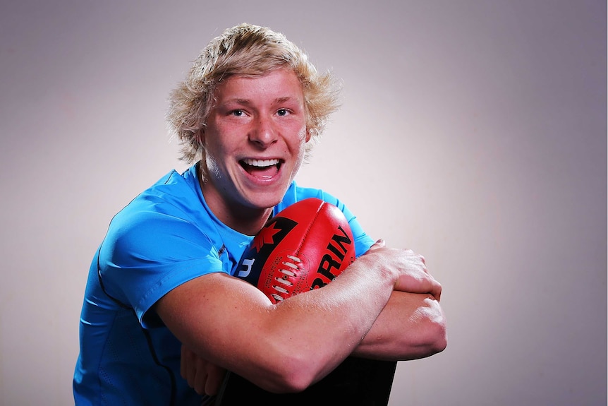 Sydney academy selection Isaac Heeney poses during the 2014 AFL Draft Combine.