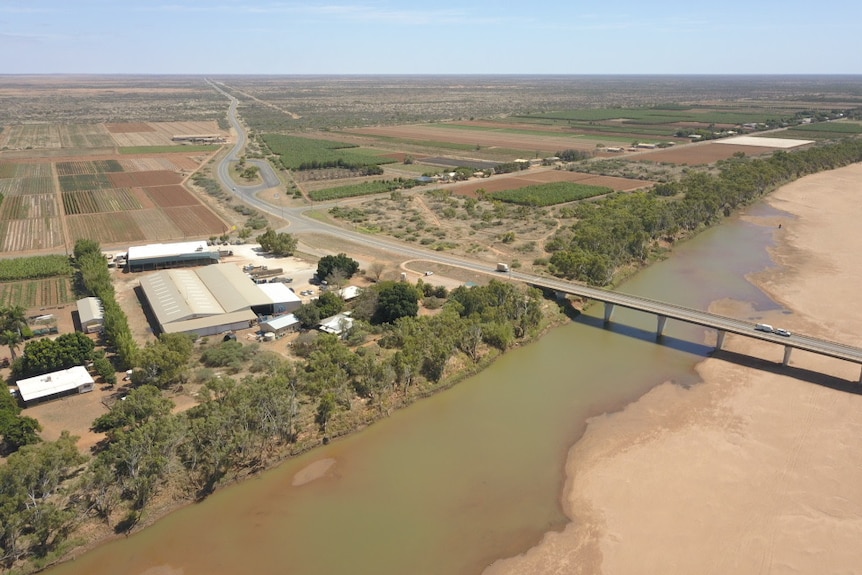 An aerial image of a river in a rural setting