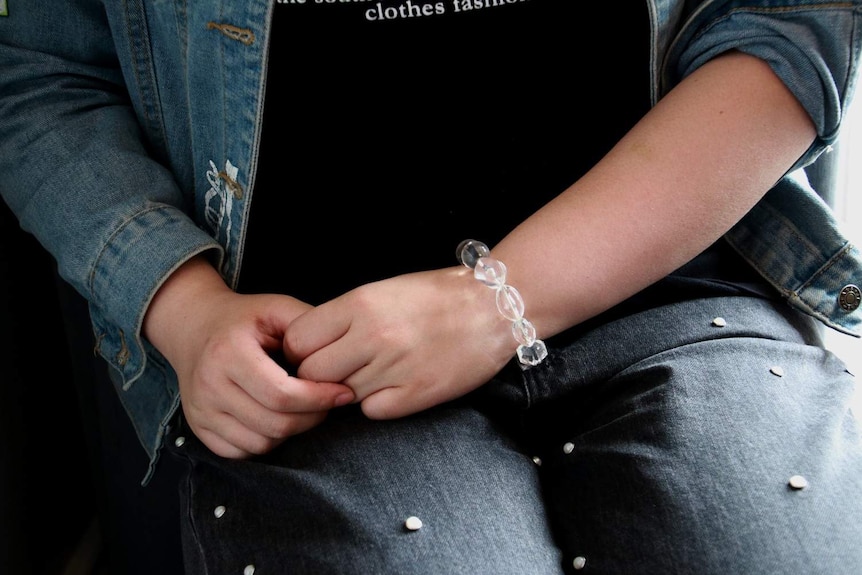 A woman's hands in her lap