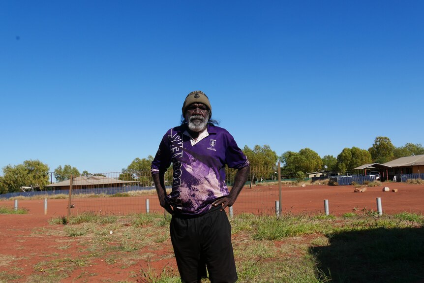 Gary Njamme is a tall Aboriginal man, pictured here in the remote community of Balgo.