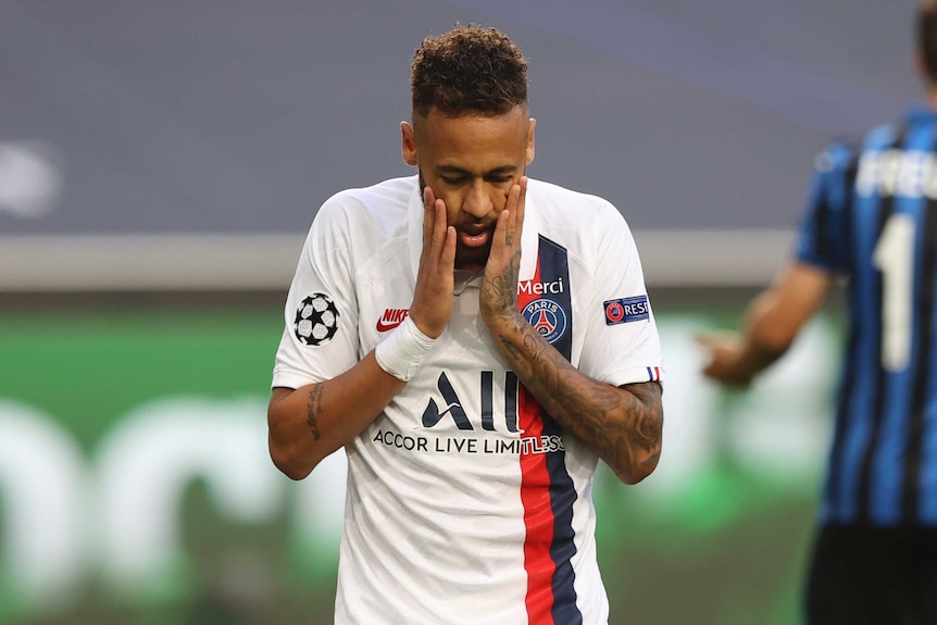 Neymar holds his hands to his face after missing a goal for Paris St Germain in the Champions League clash with Atalanta.