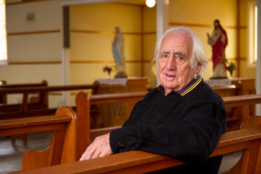 John Peckham sits on a pew in St Josephs Catholic Church, Norseman.