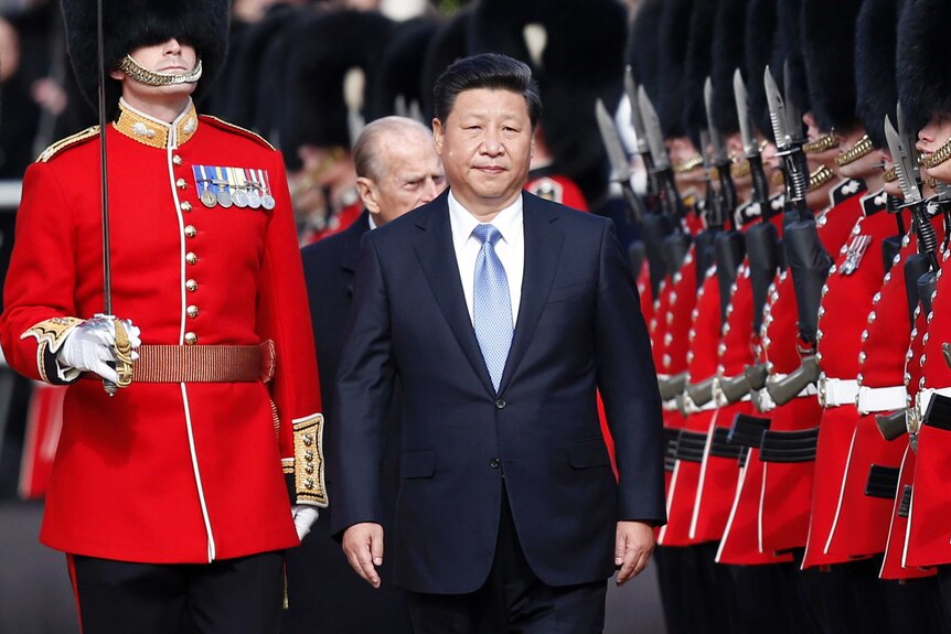 Chinese president Xi Jinping inspects a guard of honour in central London