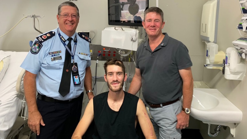 Police Commissioner Ian Stewart with Constable Peter McAulay (middle) and his father Mike McAulay.