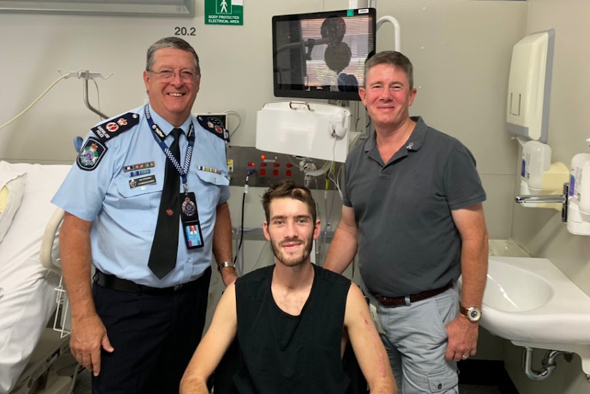 Police Commissioner Ian Stewart with Constable Peter McAulay (middle) and his father Mike McAulay.