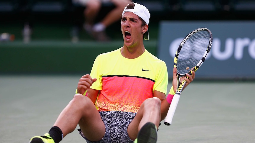 Thanasi Kokkinakis of Australia celebrates defeating Juan Monaco