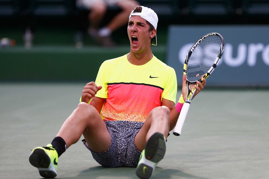 Thanasi Kokkinakis of Australia celebrates defeating Juan Monaco