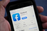 The Facebook app is shown in the app store on a smart phone