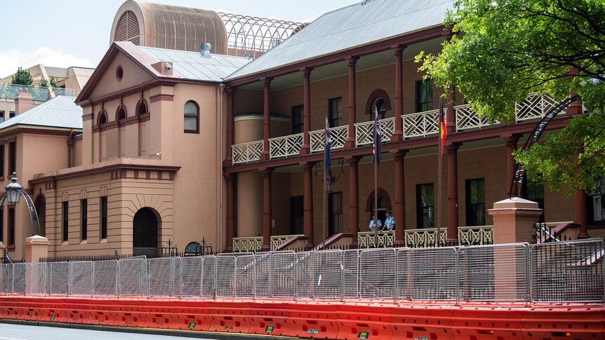 the exterior of NSW parliament surrounded by construction fences