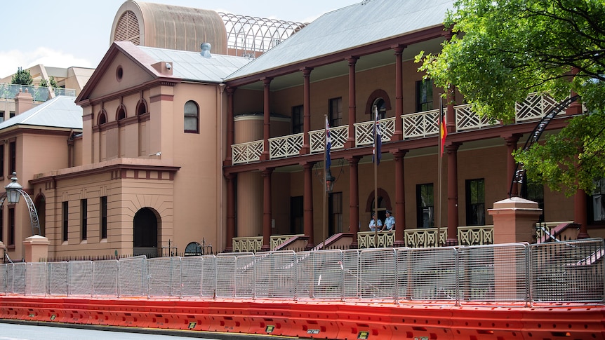 the exterior of NSW parliament surrounded by construction fences
