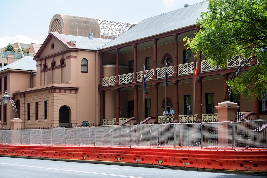 the exterior of NSW parliament surrounded by construction fences