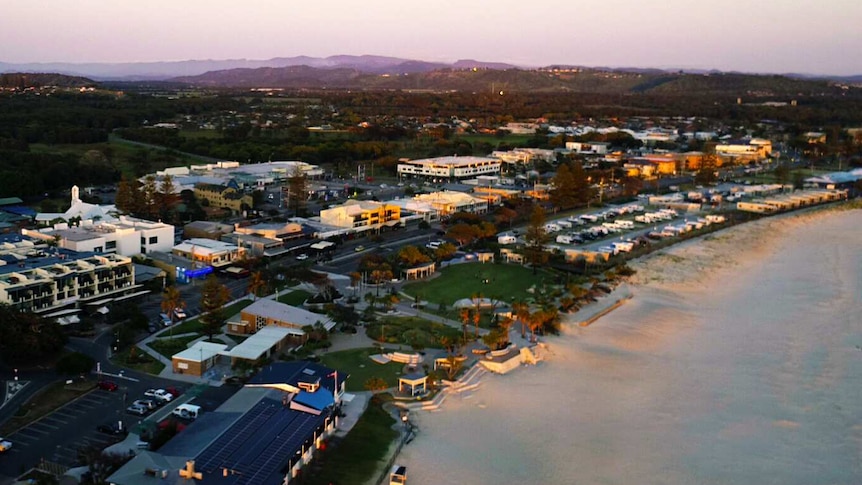 drone shot of a beach and buildings