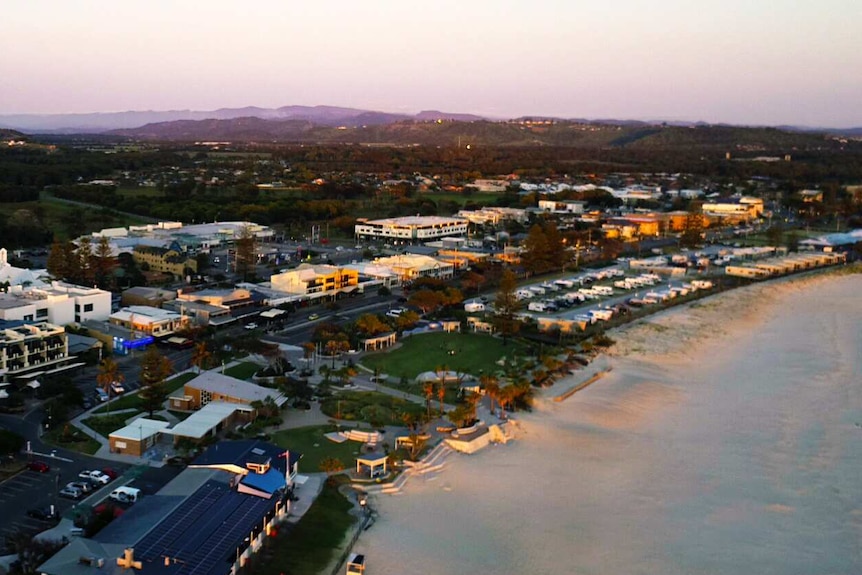 drone shot of a beach and buildings