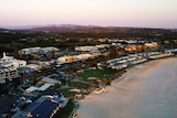 drone shot of a beach and buildings